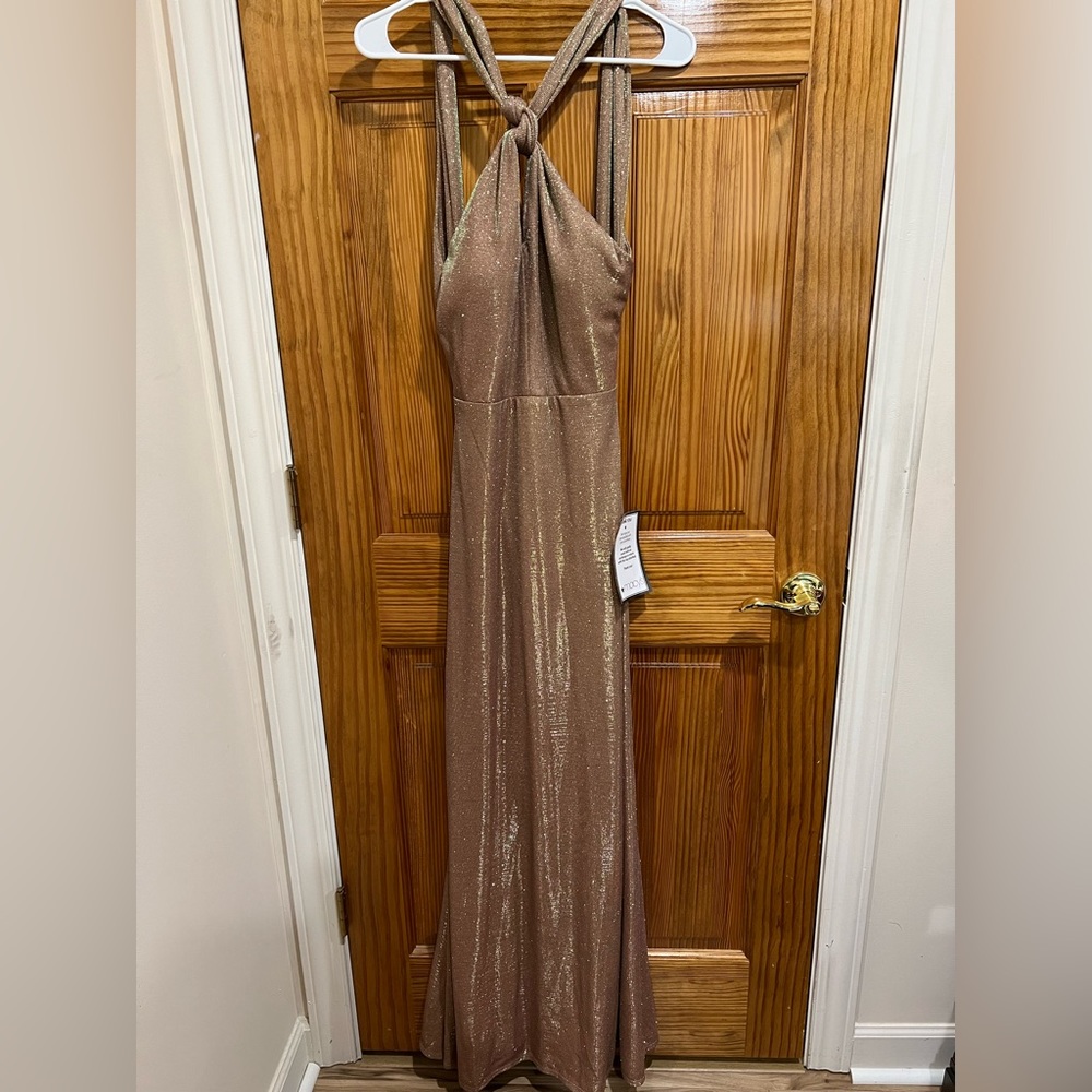 Beautiful floor length party/ formal gown. Size 5. Brand new with tags.